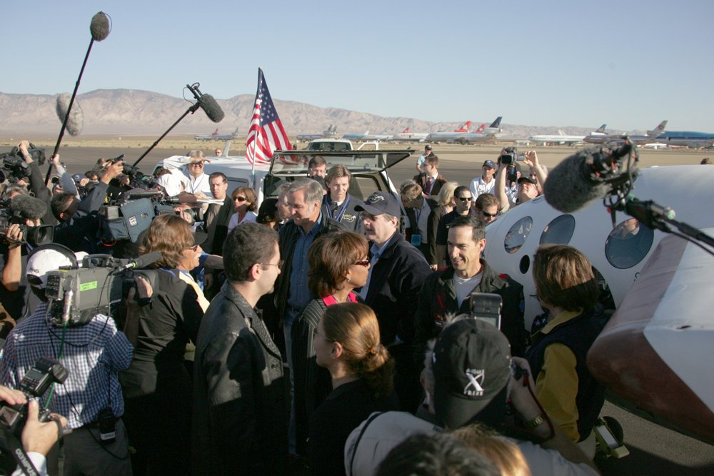 Brian Binnie surrounded by press cameras beside SpaceShipOne after the X Prize-winning flight