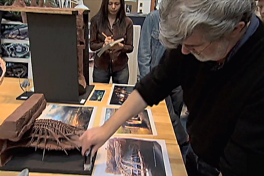 George Lucas reviewing set models and concept art with his team