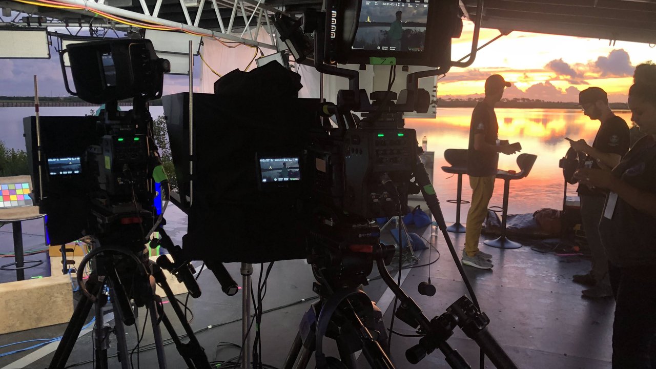 Broadcast cameras on the Meta stage at sunset, Kennedy Space Center