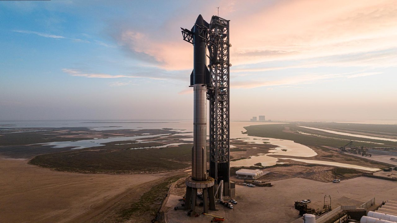 SpaceX Starship stacked on the launch tower at dawn