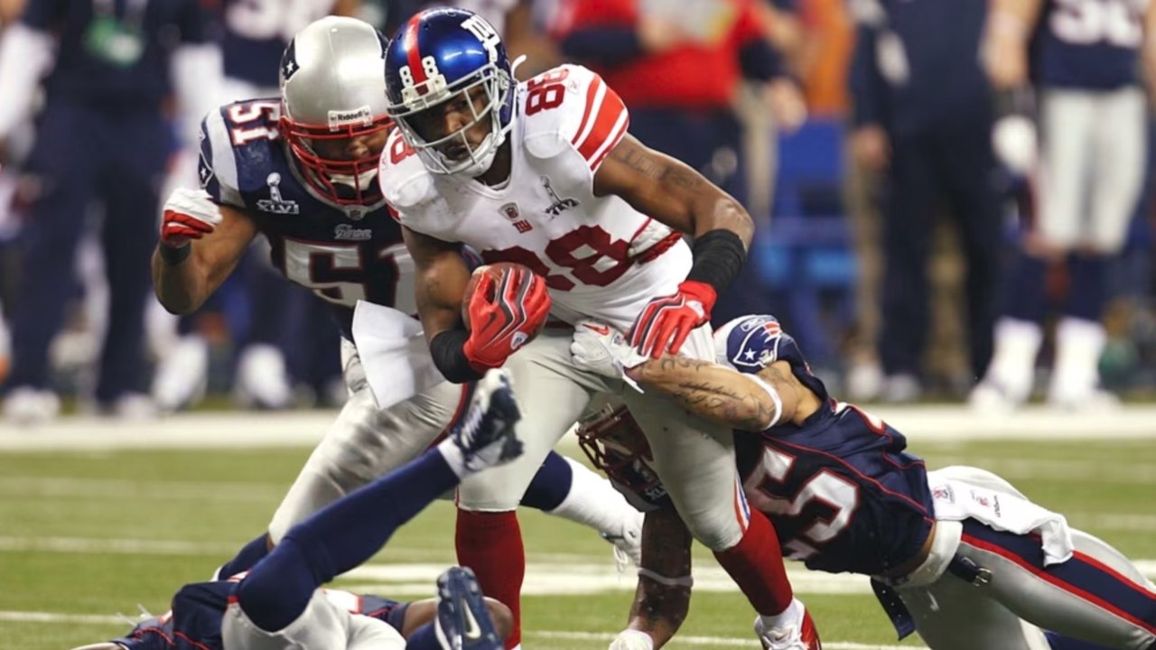 A Giants receiver breaks a tackle against the Patriots in the Super Bowl